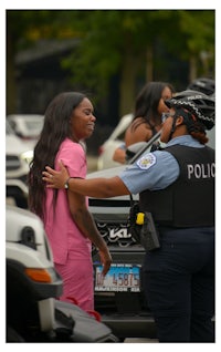 a police officer talking to a woman