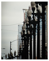 a row of street lamps on a street