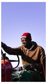 a man driving a tractor